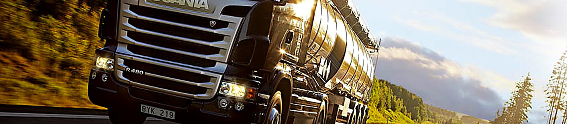 Freight truck on the open road at sunrise